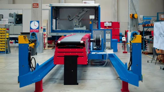 Robot painted blue unloading a sea container
