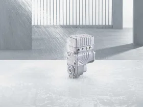 MOVIGEAR® Grey MOVIGEAR® drive unit on a concrete substrate that is sprayed with water
